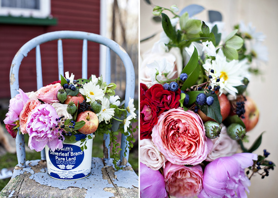 Floral arrangement in vintage lard bucket on blue chair