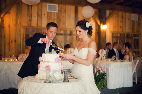 Bride and groom cutting their wedding cake