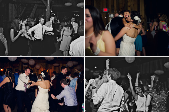 Wedding guests joyfully dance at reception