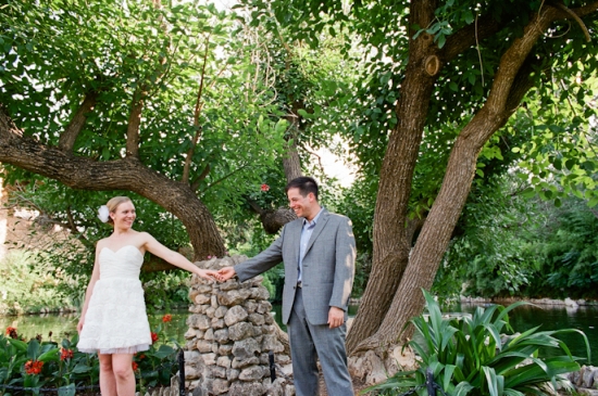 Happy couple holding hands in garden