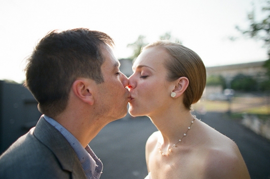 Bride and groom share a loving kiss on their wedding day