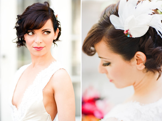 Elegant bride with short curly hair and feathered accessory