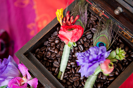 Boutonnieres with coffee beans and peacock feathers