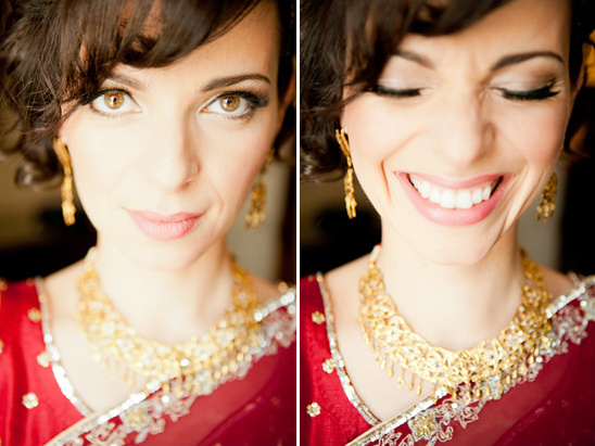 Woman smiling wearing traditional Indian jewelry sari