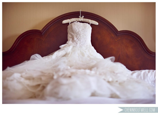 Elegant wedding dress on bed