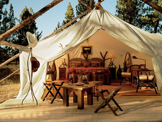 Rustic glamping tent interior, cozy and warm