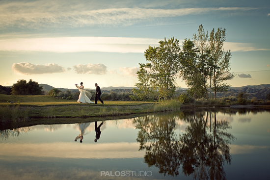 Couple walking near lake, wedding scene