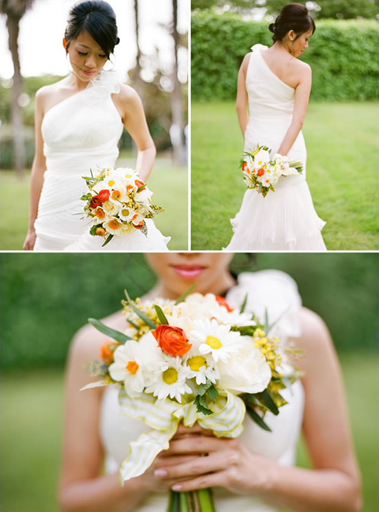 Asian bride in one shoulder wedding dress holding bouquet