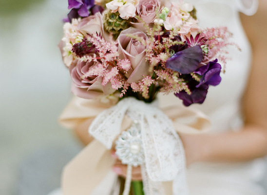 Elegant purple and pink bridal bouquet with lace