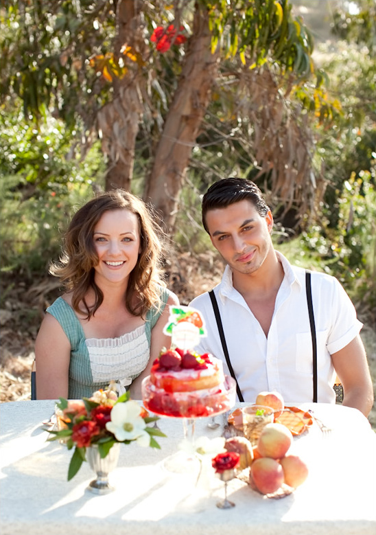 Couple enjoys romantic outdoor picnic with cake