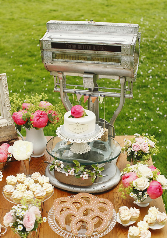 Vintage scale with wedding cake and treats