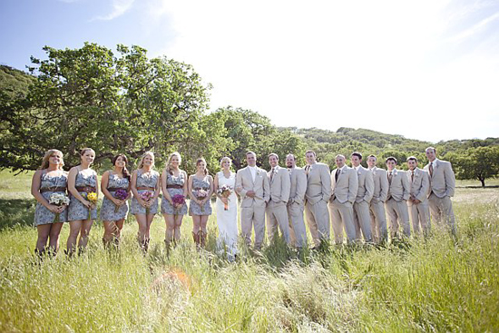Wedding party in meadow with cowboy boots