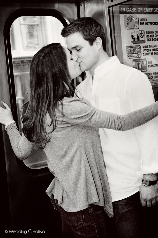 Romantic couple kissing on a train platform