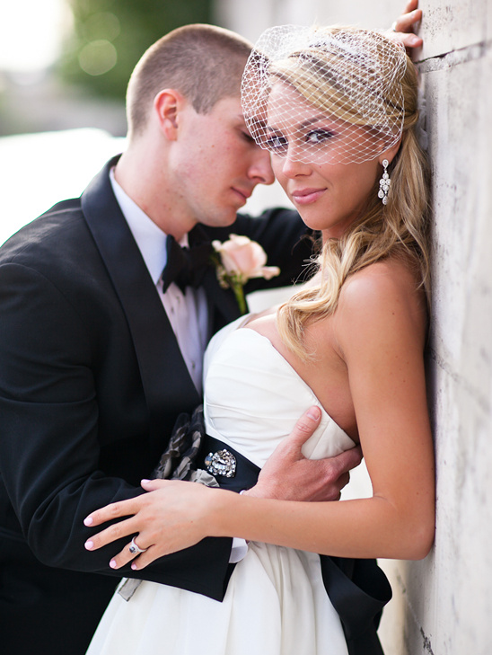 Elegant bride and groom embrace on their wedding day