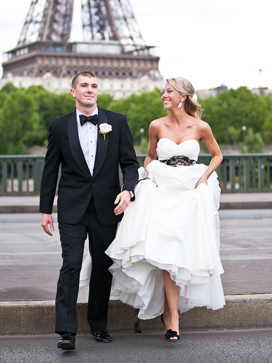 Bride and groom pose in Paris with Eiffel Tower