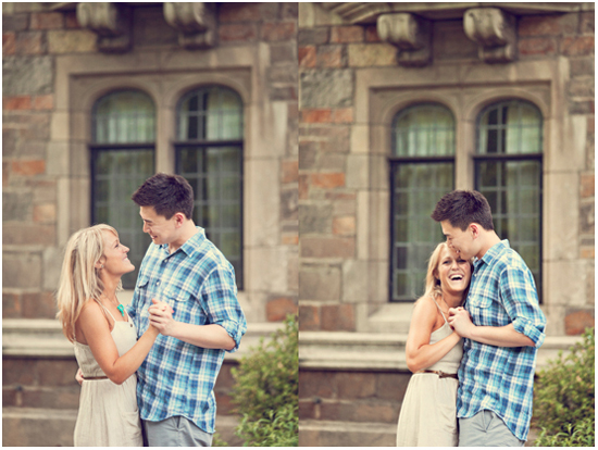 Happy young couple embracing outdoors near stone building