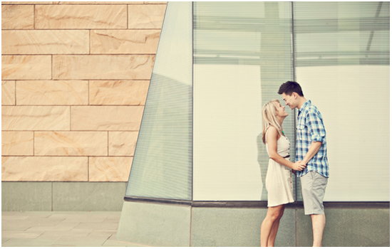 Romantic young couple gazing lovingly at each other outdoors