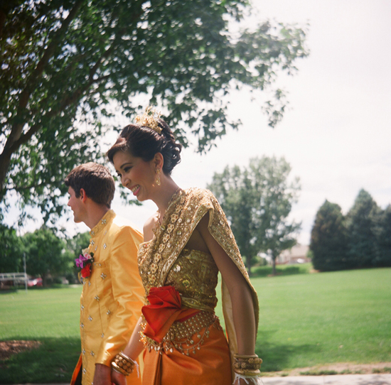 Happy bride and groom in traditional Thai wedding attire