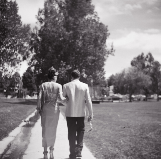 Bride and groom walking away hand in hand