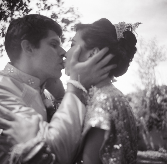 Romantic couple sharing a tender kiss outdoors