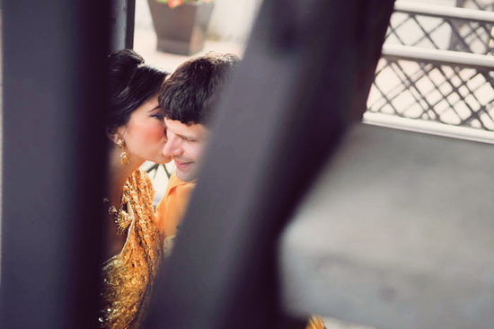 Romantic couple sharing a tender moment, partially hidden