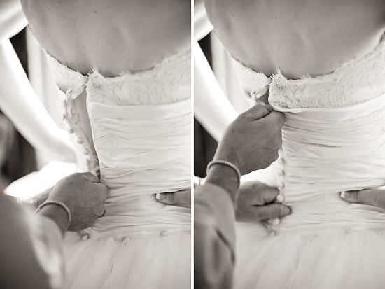 Bride getting her wedding dress buttoned up closeup