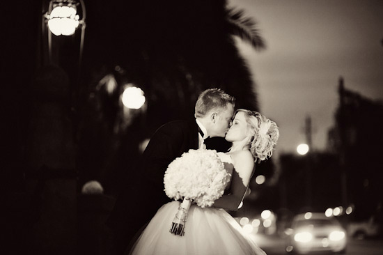 Newlyweds share a romantic kiss on their wedding day