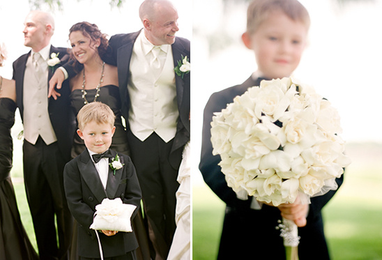 Ring bearer and boy holding flowers at wedding ceremony
