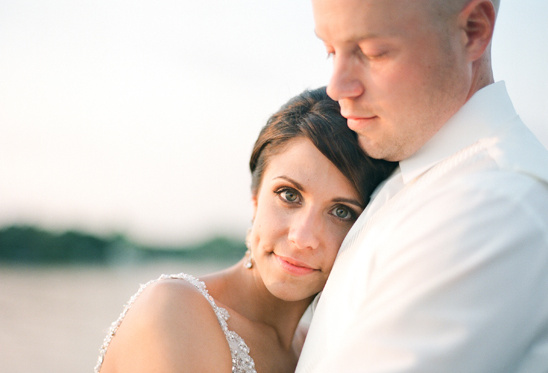 Happy bride and groom embracing lovingly