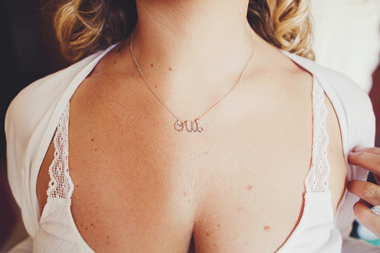 Bride wears an Oui pendant necklace and lace top