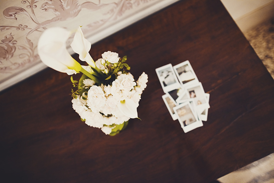White calla lilies and carnations near photos