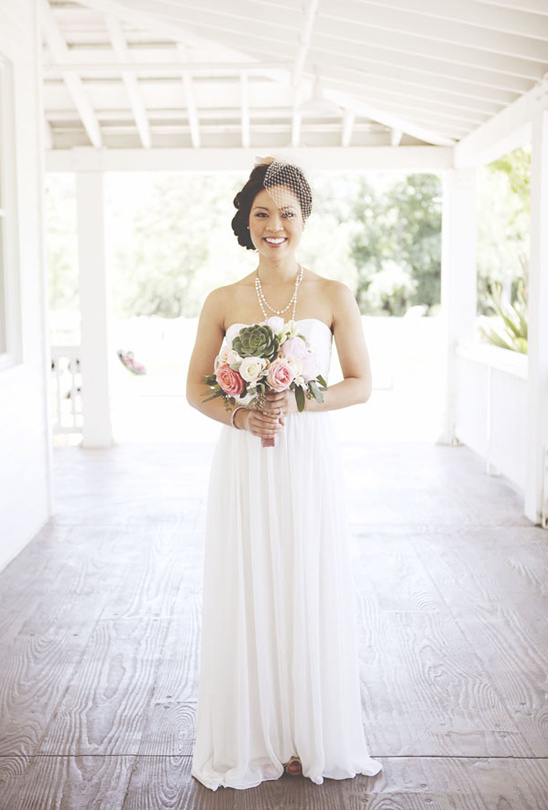 Bride in white wedding dress with bouquet