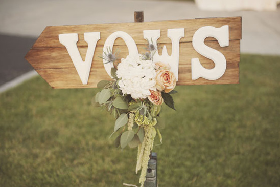 Wooden sign vows with flowers