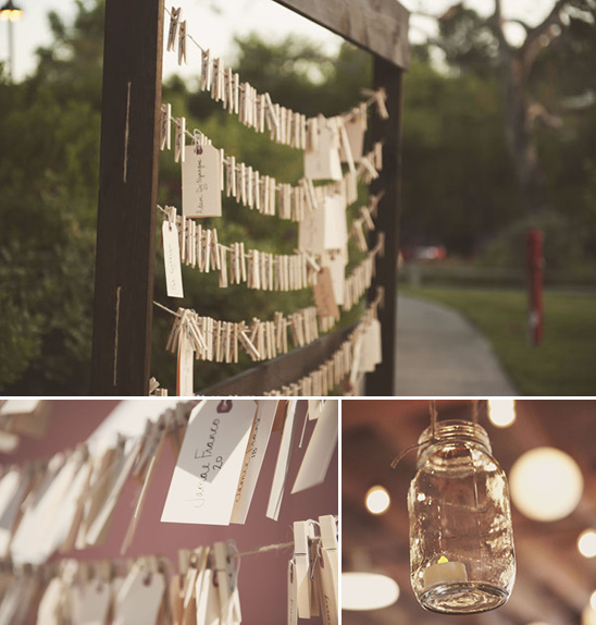 Wedding place card display with mason jar candles