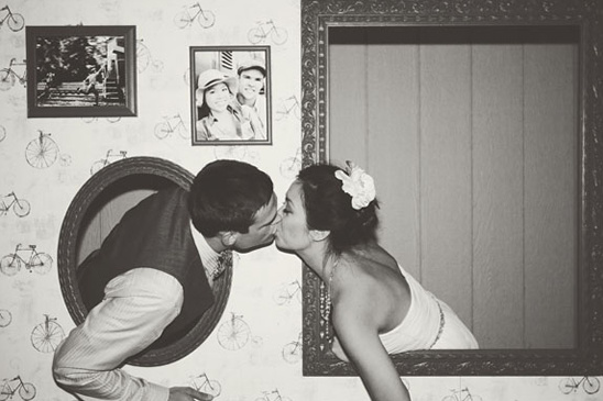 Retro wedding photo booth kiss in black and white effect