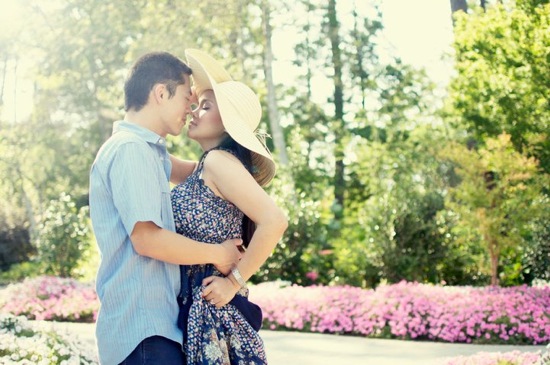 Romantic couple kissing in a garden