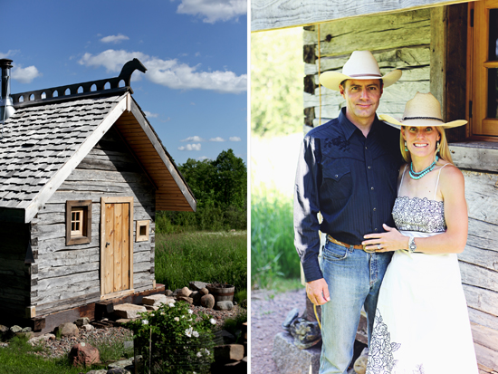 Couple in cowboy hats near rustic log cabin