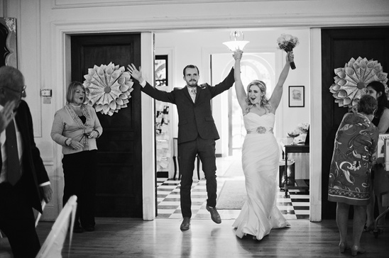 Black and white wedding celebration jump for joy