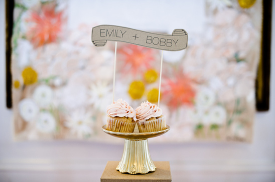Emily and Bobby cupcakes celebration with floral backdrop