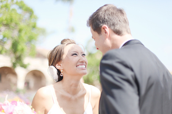 Bride smiles at groom wedding day happiness