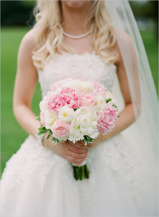Bride holding a lovely pink and white peony wedding bouquet
