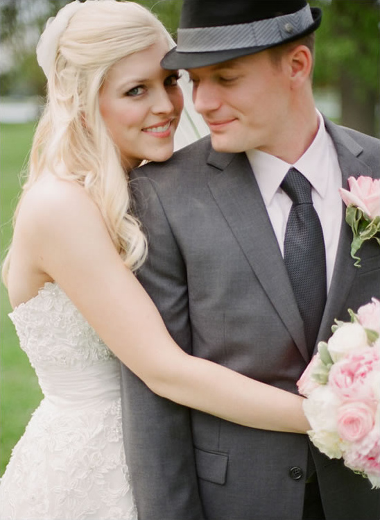 Happy bride and groom embracing on wedding day