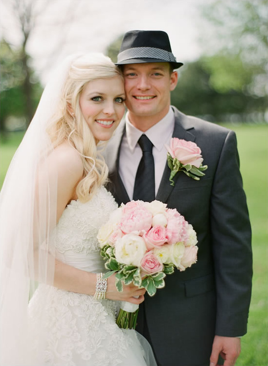 Happy bride and groom pose for wedding photo