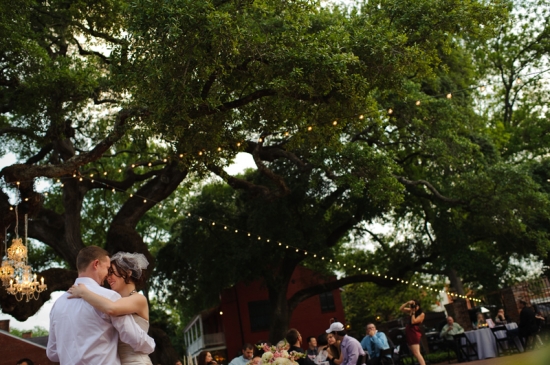Wedding couple's first dance under twinkling lights