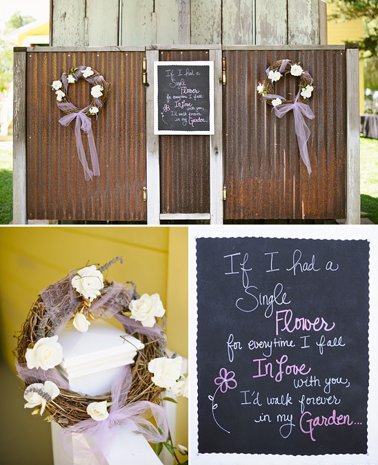 Rustic wedding decor with wreaths and chalkboard sign