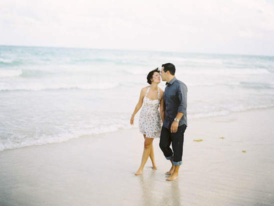 Couple kissing on beach, romantic moment