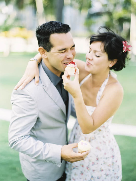 Couple sharing cupcake, sweet moment