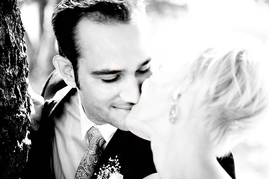 Couple kissing, romantic wedding photo