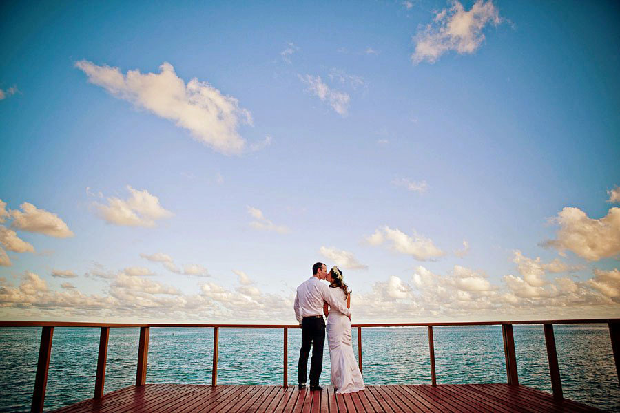 Tom and Lynette kissing in oceanfront ceremony in Fiji