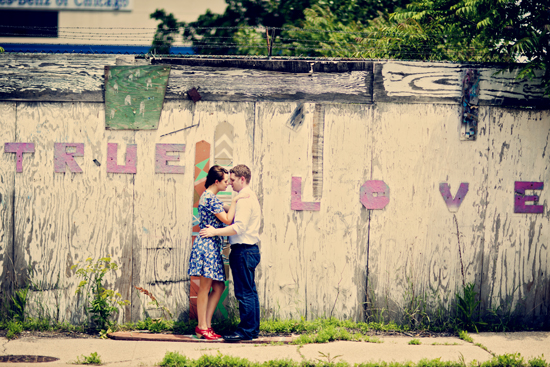 Couple embracing by True Love graffiti